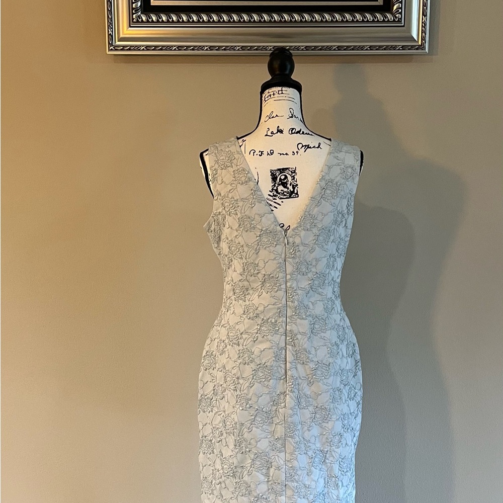 Ice Blue dress never worn. Size 10 runs small.